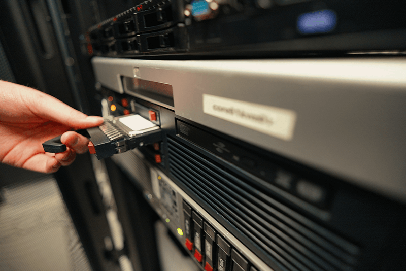 SSD being inserted into a server rack